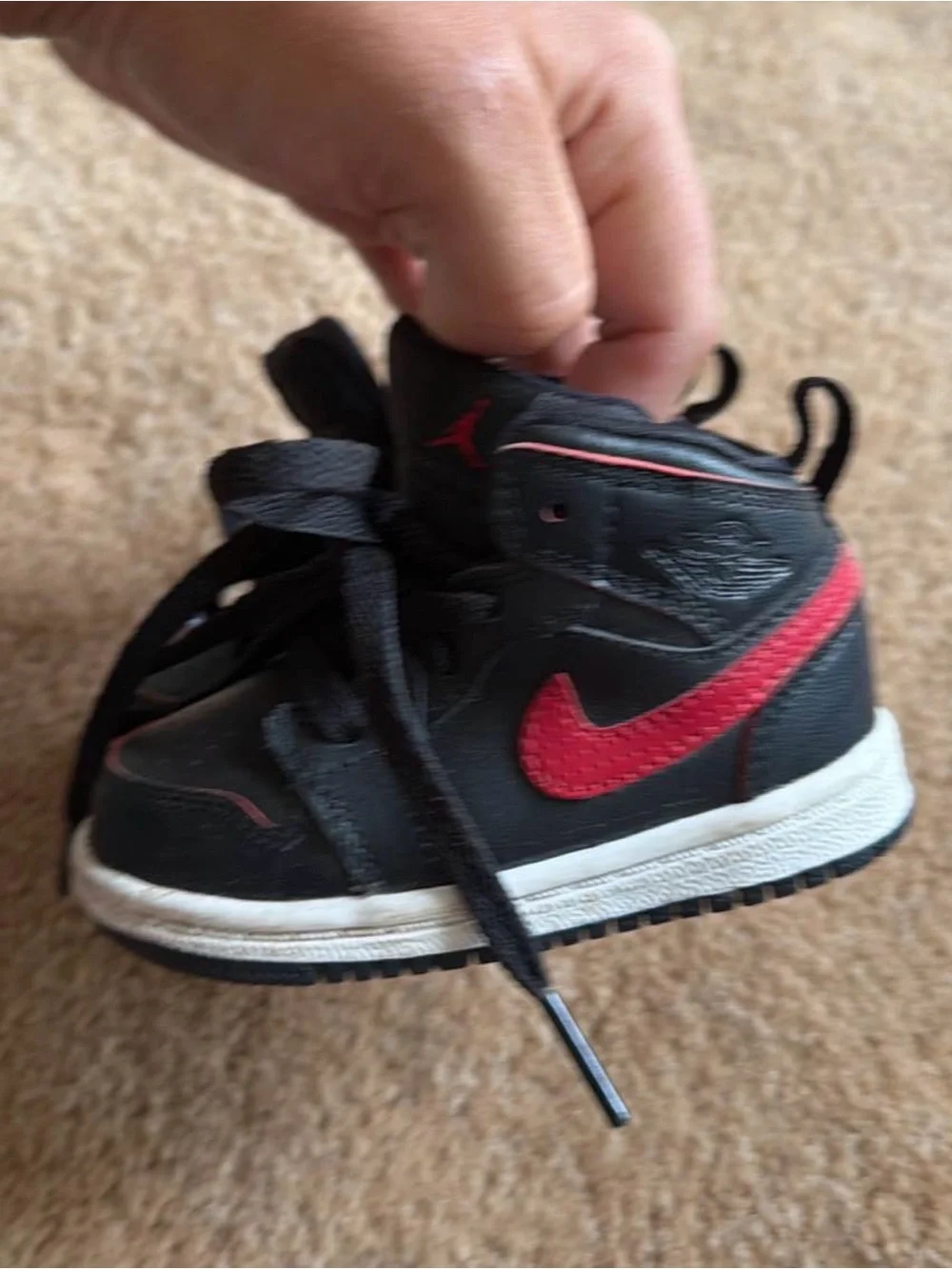 Nike Kids Black Sneakers with Red Swoosh